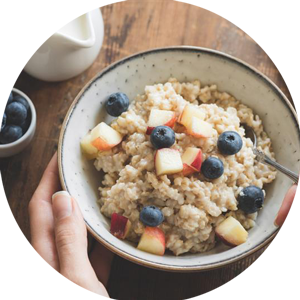 Bowl with a healthy breakfast and fruits and other foods.